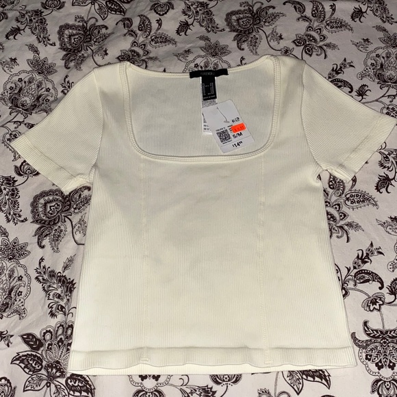 Selling top from forever 21 the size is S/M the color is cream white - Picture 1 of 4